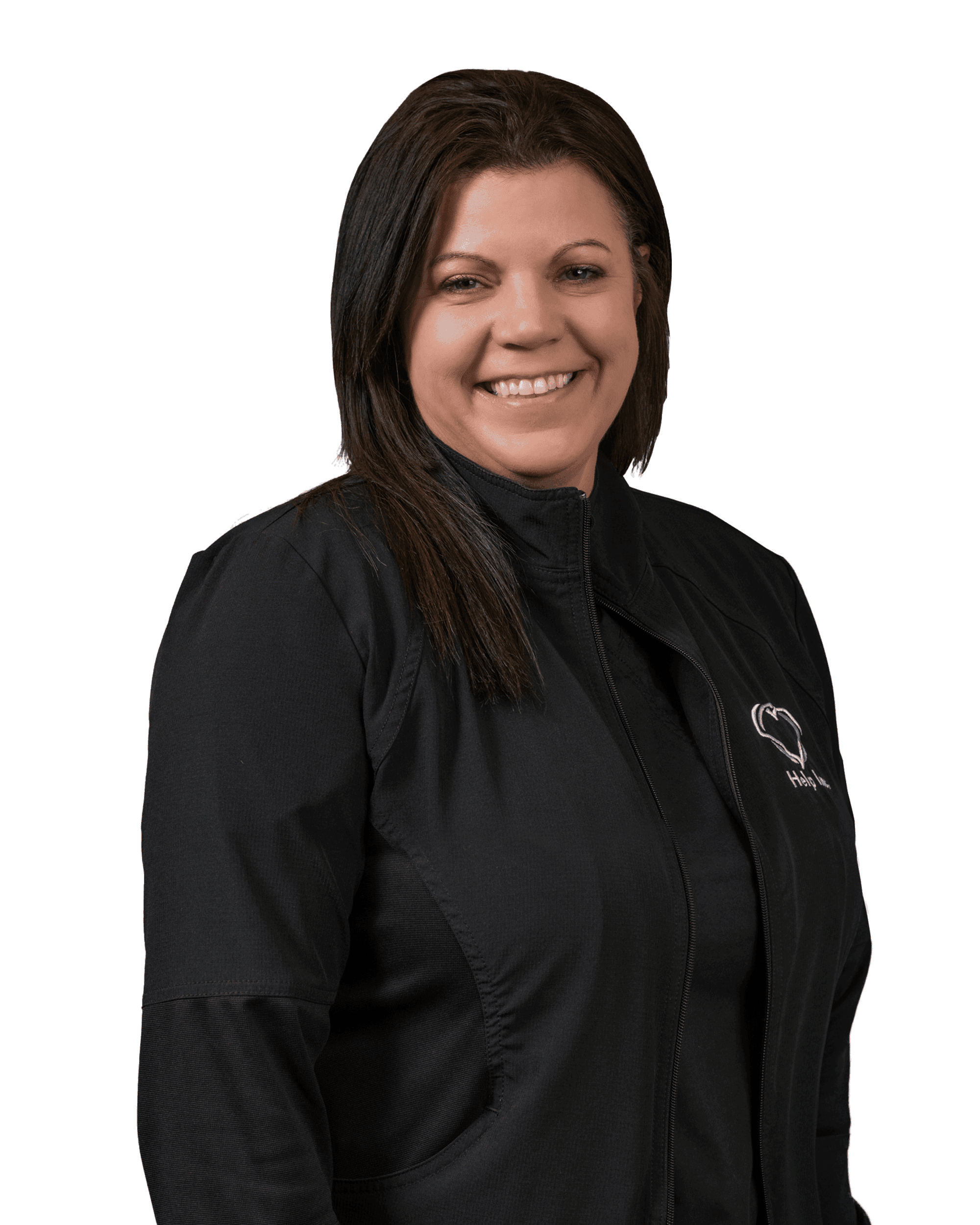 A woman with straight brown hair wearing a black zip-up jacket stands smiling against a white background.